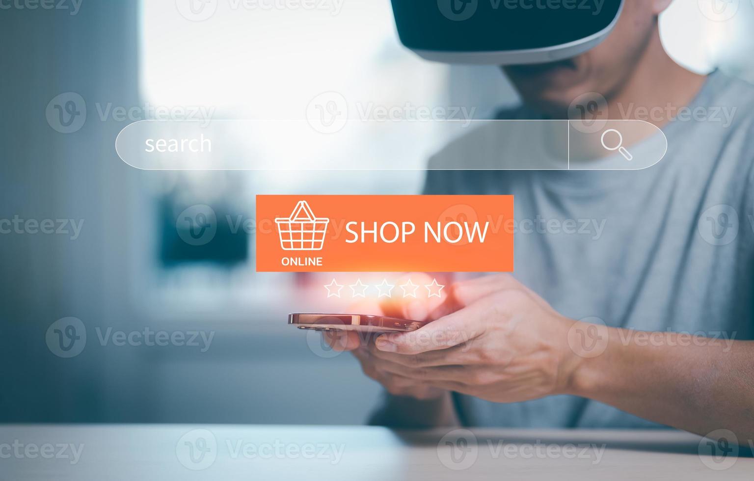 Man wearing VR glasses virtual using smartphone with Searching Browsing Internet Data Information with blank search bar. man's hands are using smartphone and keyboard,Online shopping, e-commerce. photo