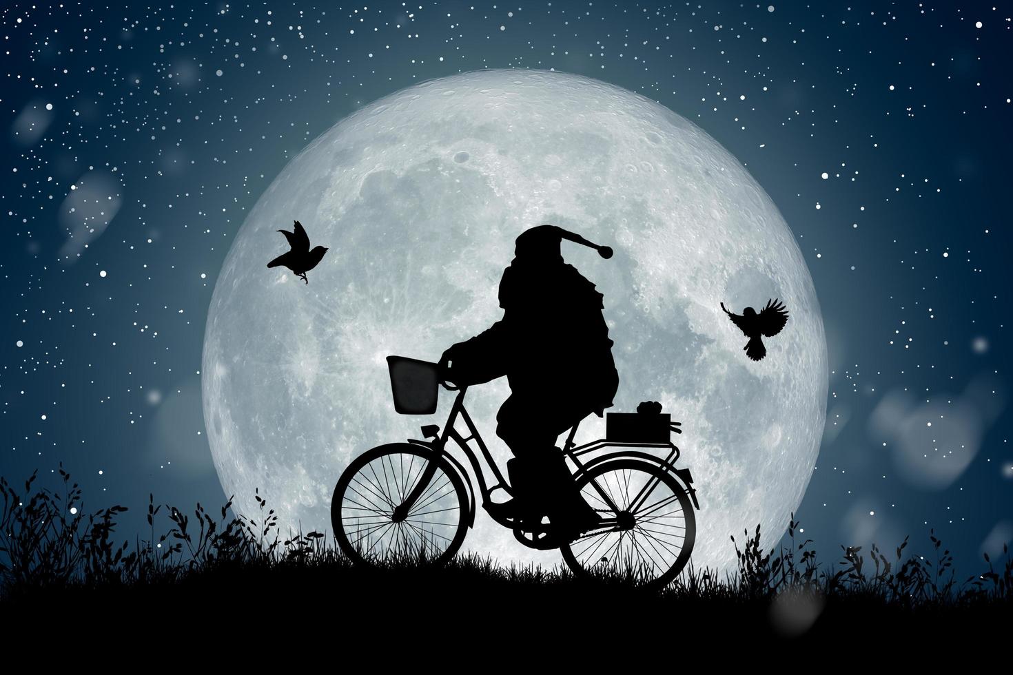 silueta de santa claus montando en su bicicleta sobre la luna llena. foto
