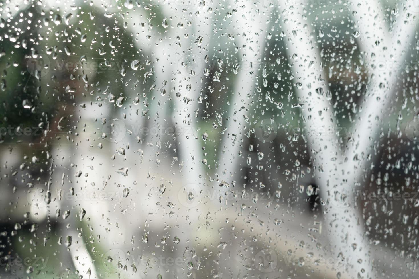 Morning city,view through the window on rainy day. Water droplets ...