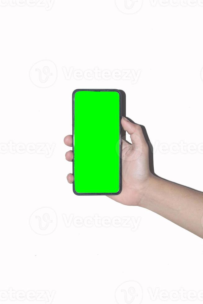 Male hand holding a mobile phone on a white background suitable for a green screen, a hand holding a green screen mobile phone photo