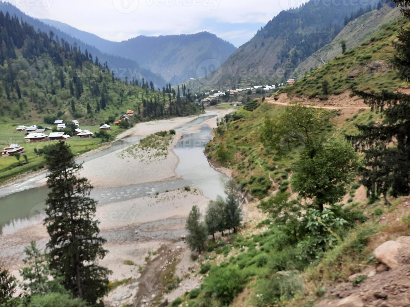 Kashmir is the most beautiful region in the world which is famous for its green valleys, beautiful trees, high mountains and flowing springs. photo