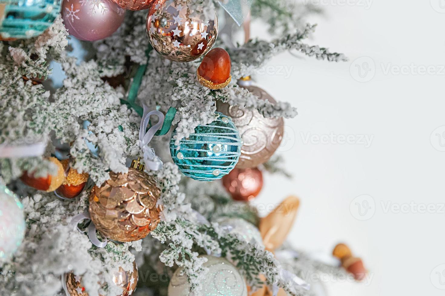 Classic Christmas New Year decorated New year tree with silver and white ornament decorations toy and ball. Modern classical style interior design apartment. Christmas eve at home. photo