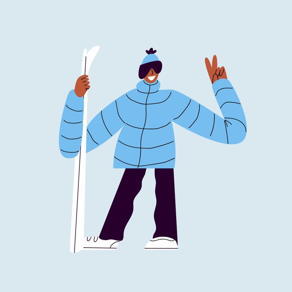 Happy skier with skis. A man in ski goggles and warm clothes is holding skis. Smiling guy in a ski suit posing for a photo on a blue background. vector