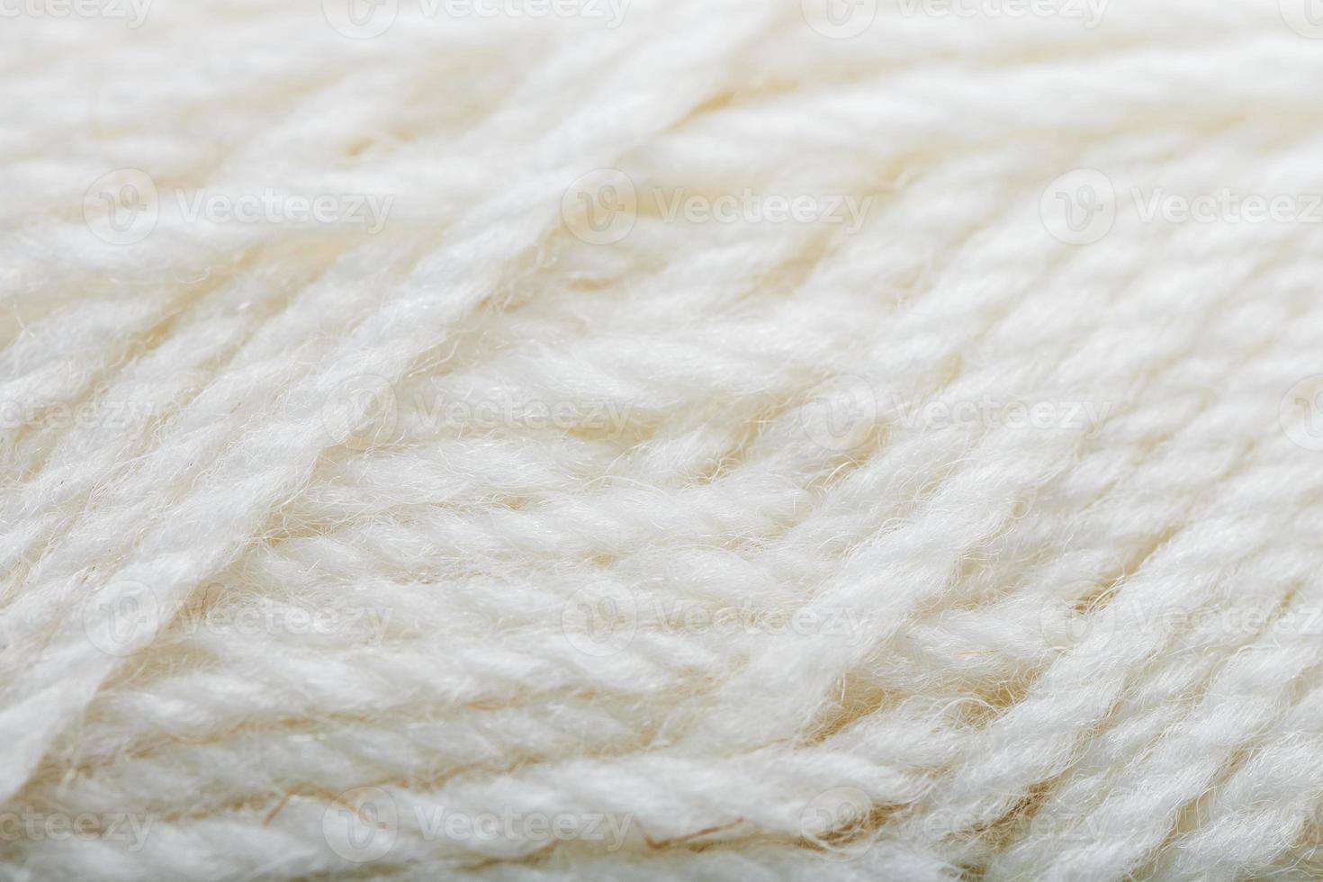 White wool yarn close-up in full screen photo