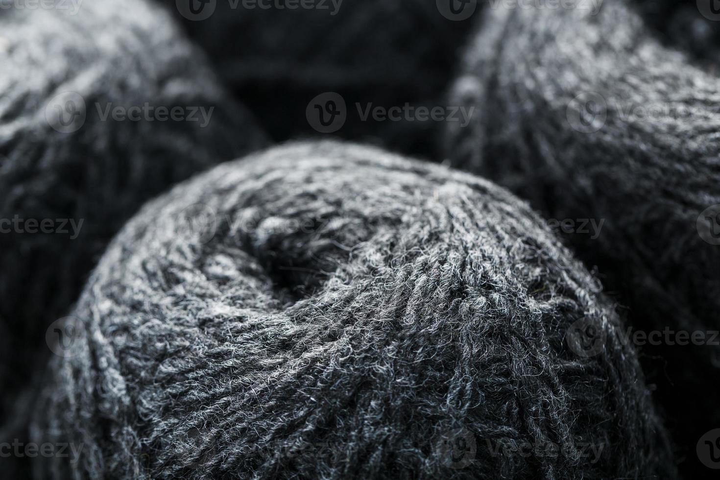Tangles of gray yarn made of natural wool close-up photo