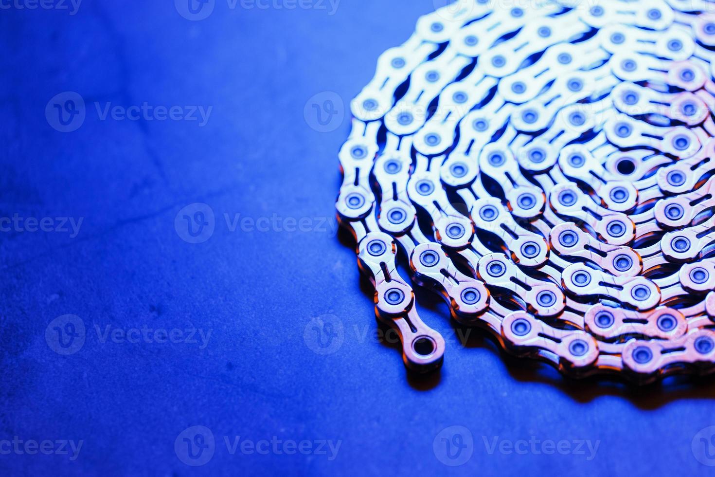 Patterns of a technological bicycle chain braided in a circle photo