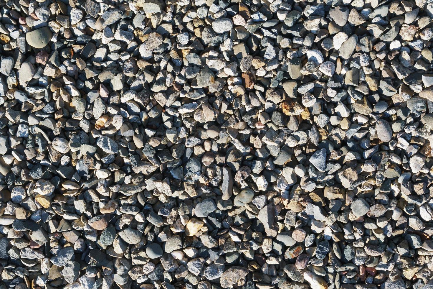 The texture of coarse gravel in full screen as a background. photo