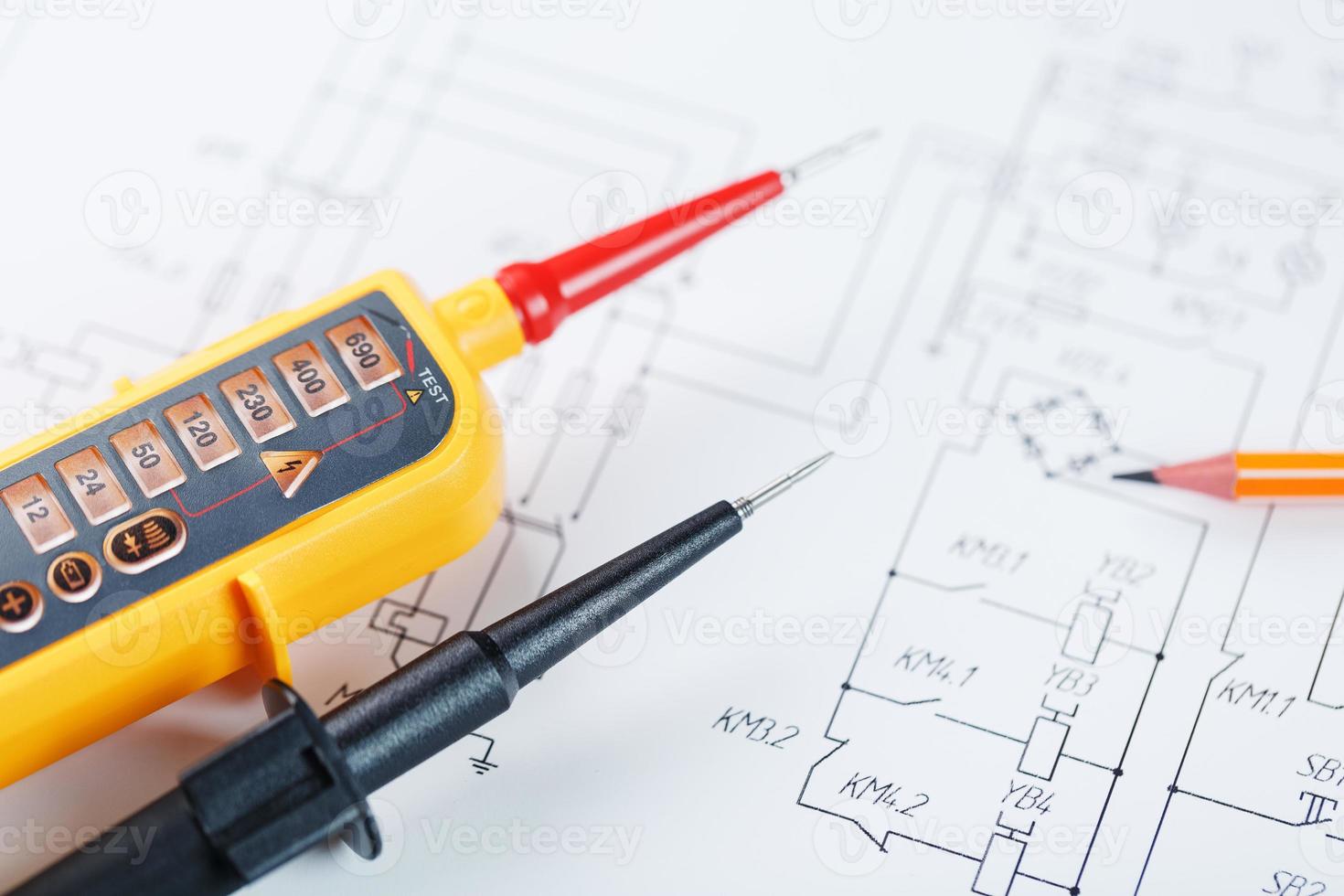 Yellow voltage indicator in close-up on the electrical diagram photo