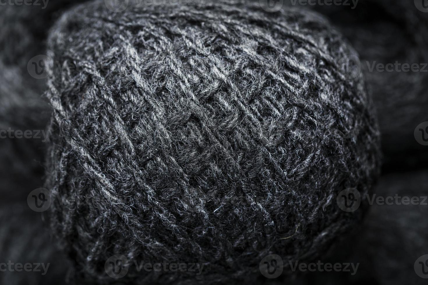 Tangles of gray yarn made of natural wool close-up photo