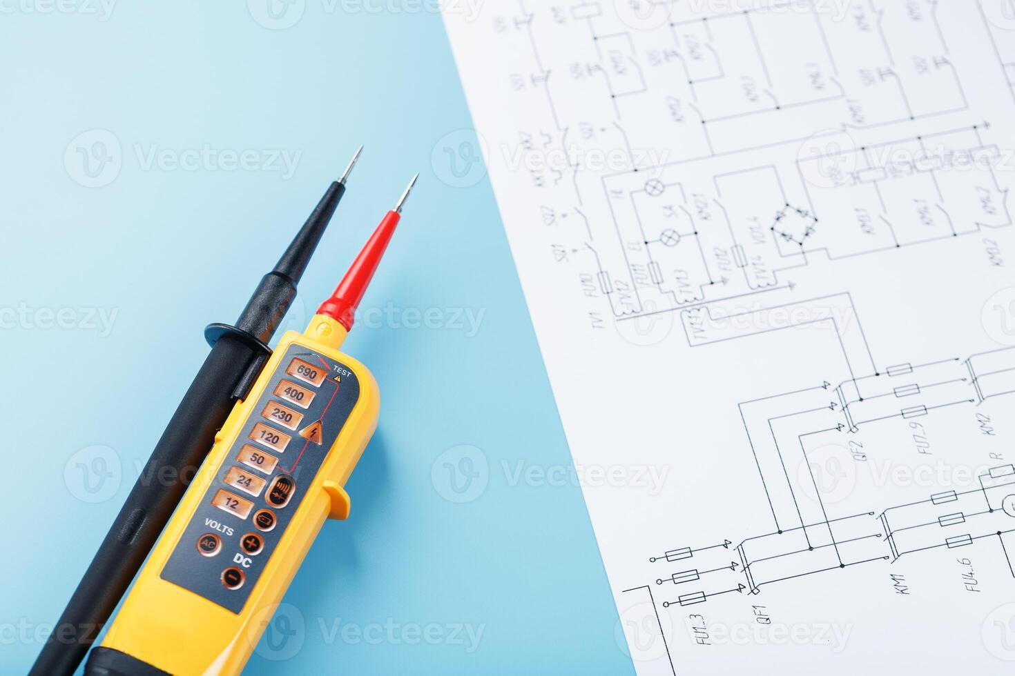 Yellow voltage indicator with an electrical diagram on a blue