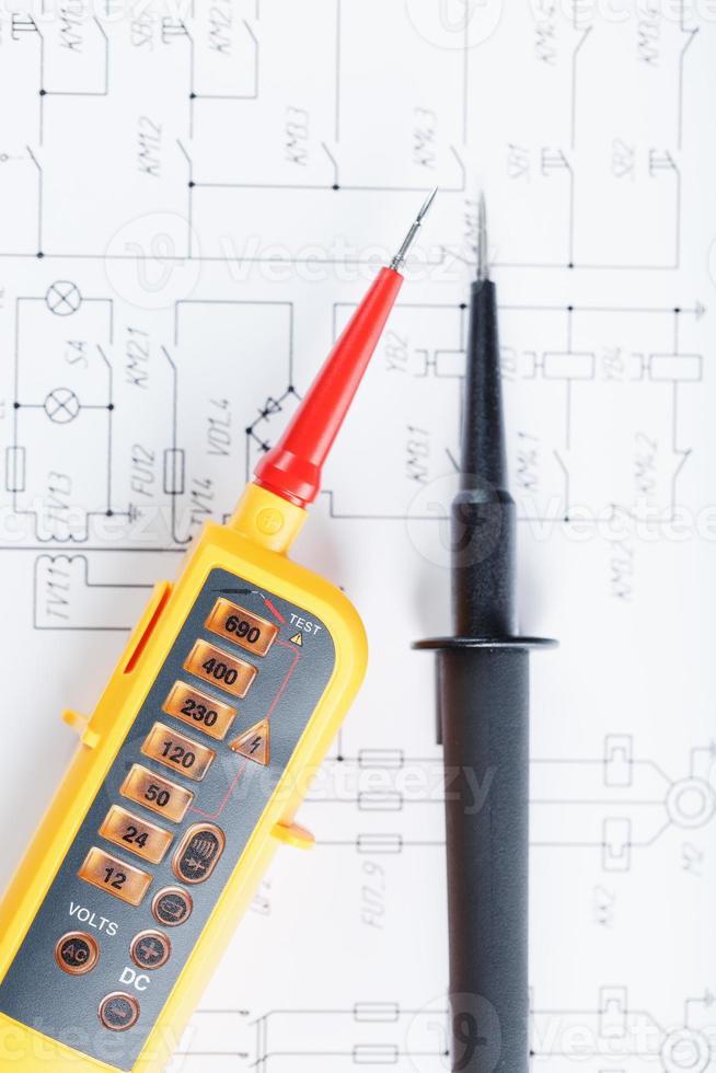 Yellow tester for step-by-step voltage indication on the electrical circuit. photo