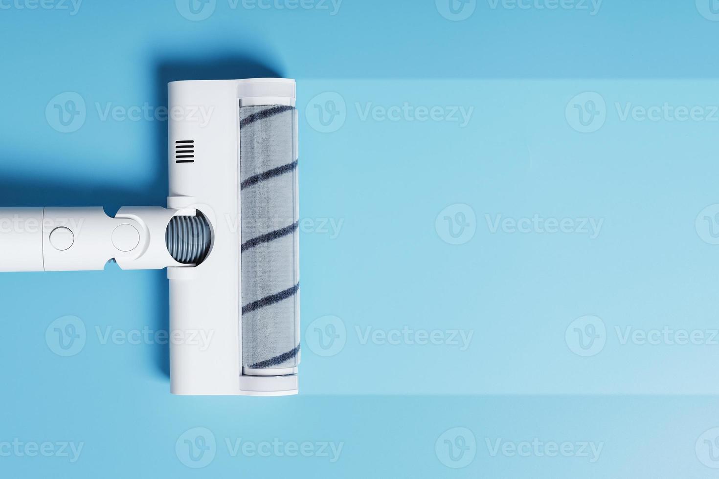 Turbo brush nozzle of a modern vacuum cleaner on a blue background With a clean stripe photo