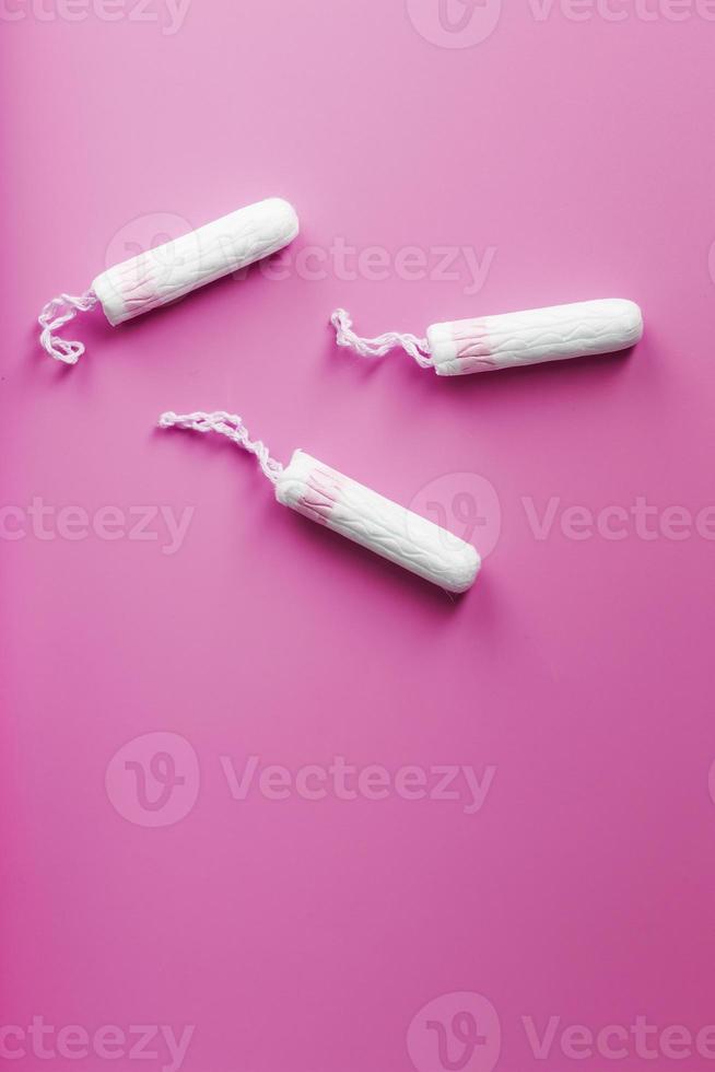 Gynecological tampons on a pink background free space photo