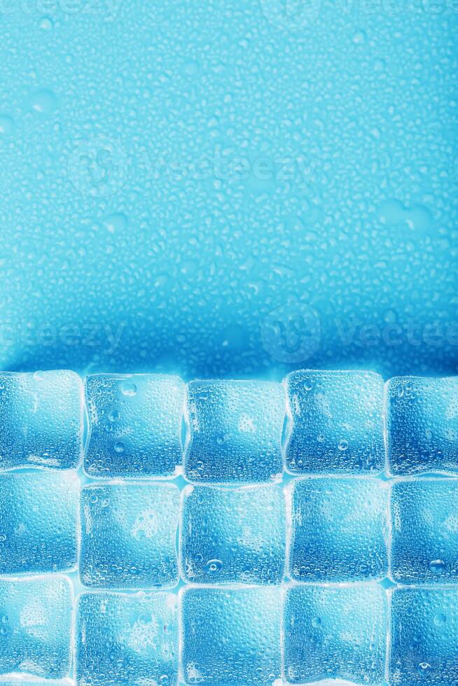 Ice made of cubes lined up with drops on a blue background 11071681