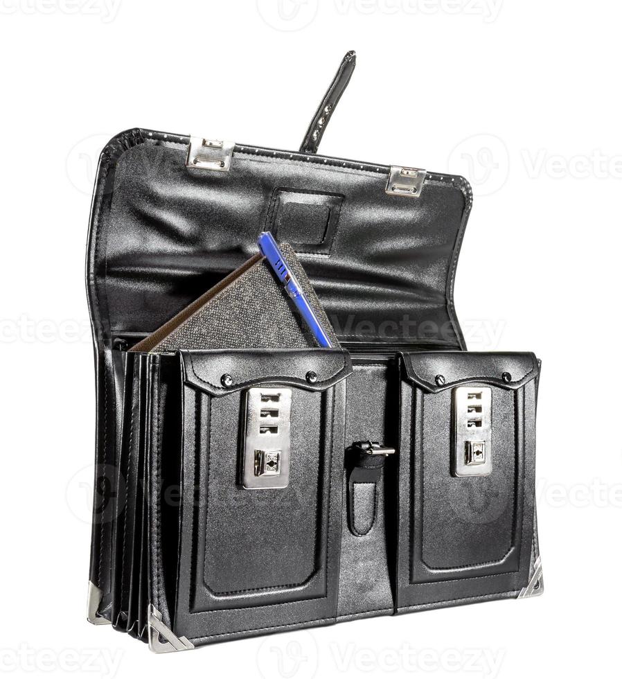 Black retro leather school bag with notebook on background photo