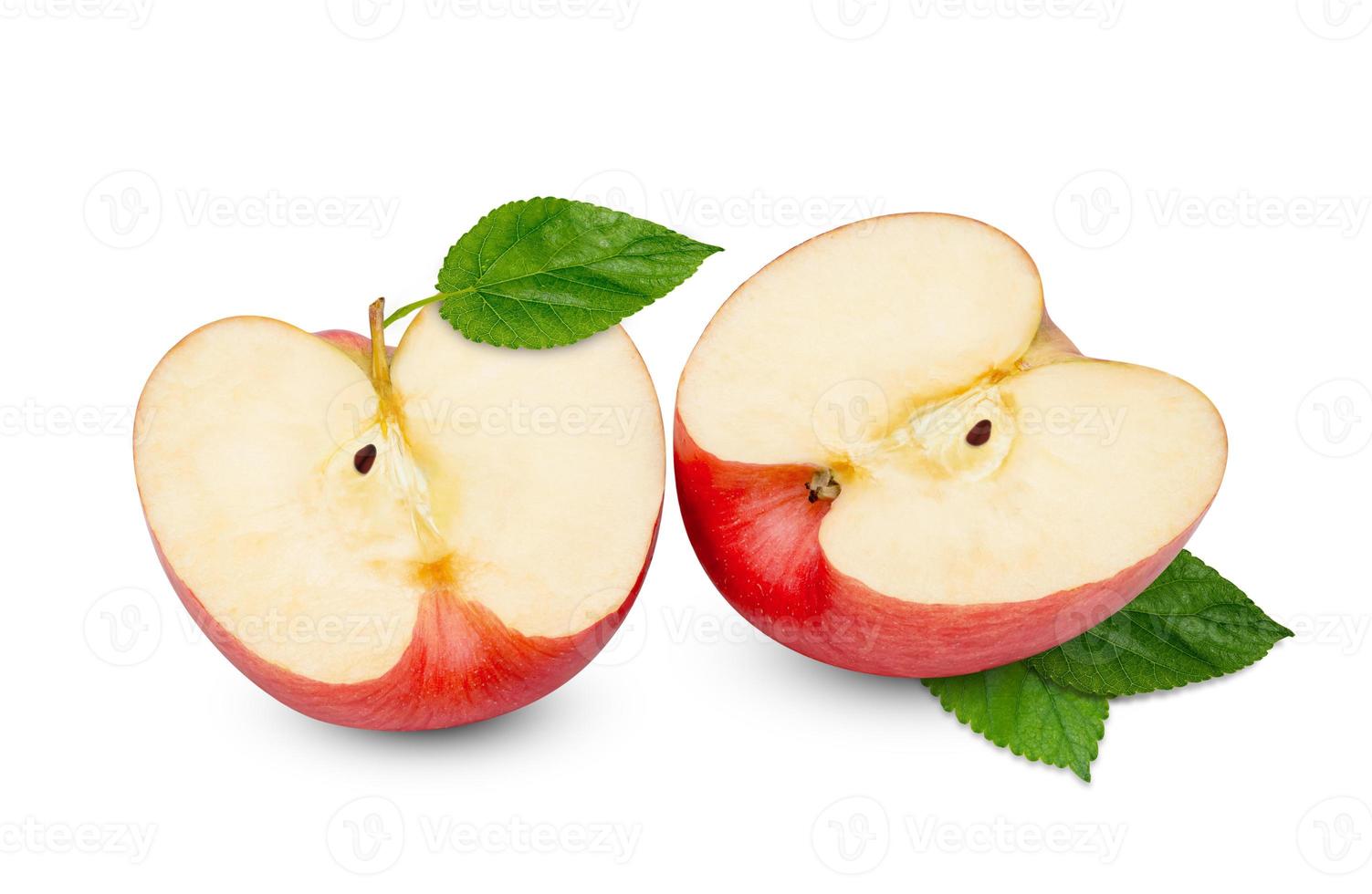 red apple cut in half with green leaf isolated on white background photo