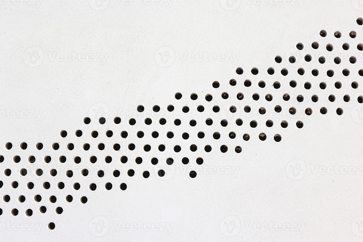 metal plate with holes on floor,abstract pattern photo