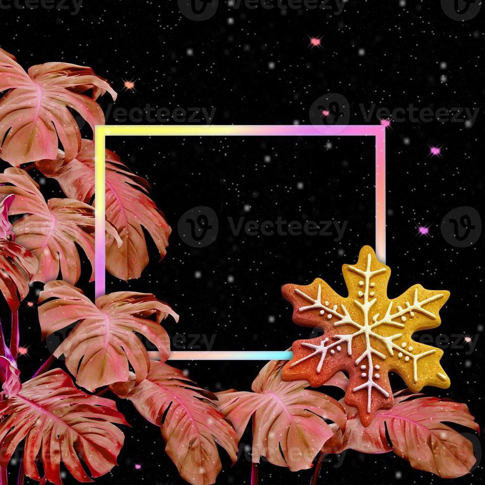 snowflake-shaped with colorful monstera leaves pattern on black background for christmas and new year concept photo