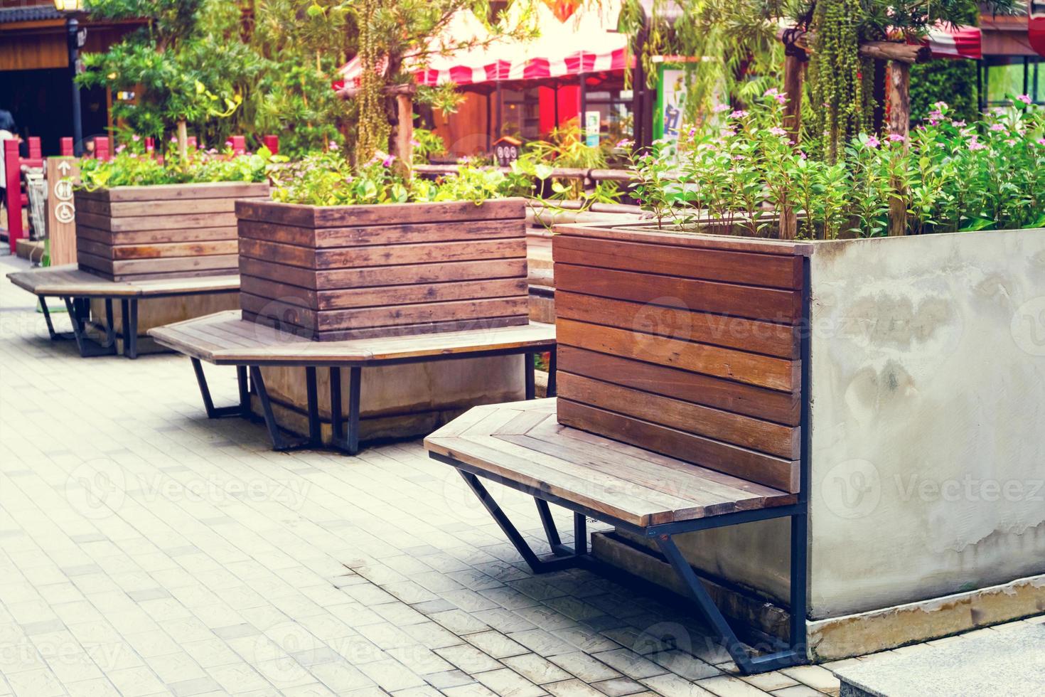 Brown wooden bench in the garden,Vintage tone photo