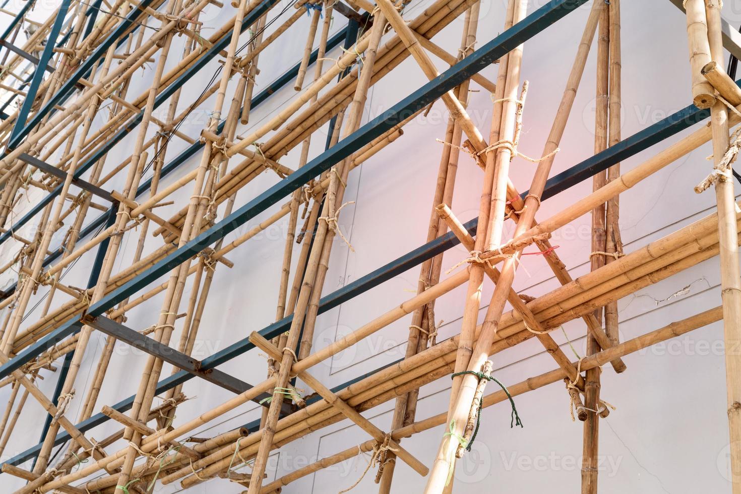 scaffolding at construction with wooden bamboo photo