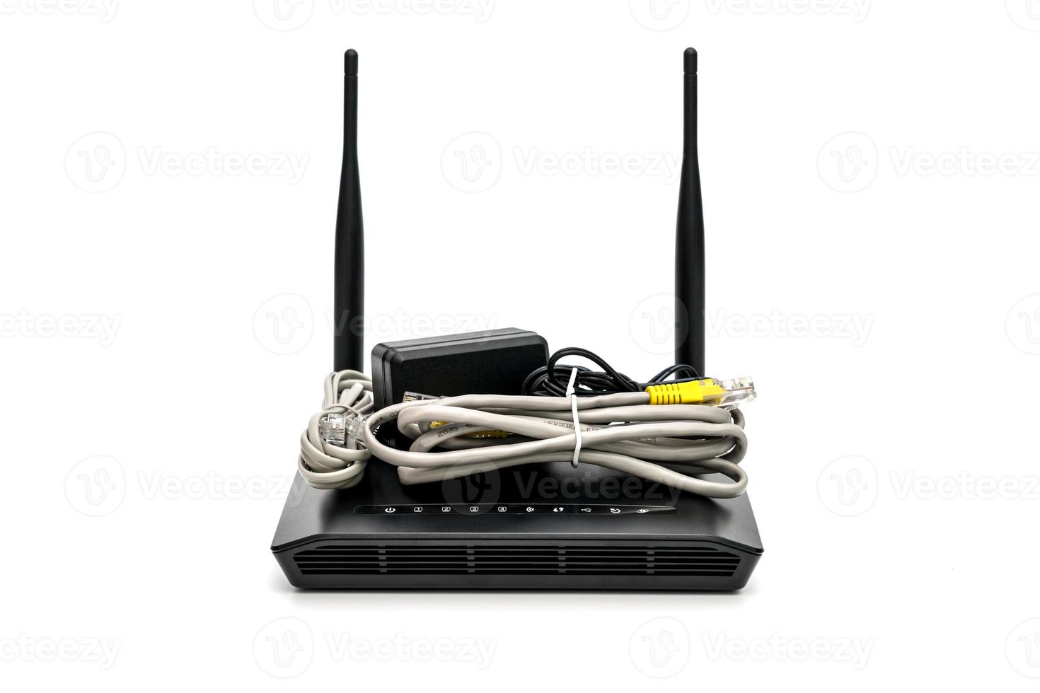 Black wireless router with local area network cable isolated on white background photo