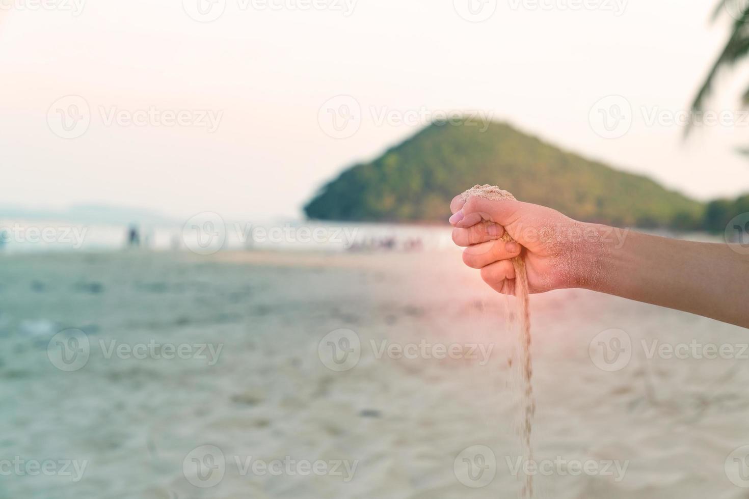 Sand in hand with sandy floor background photo