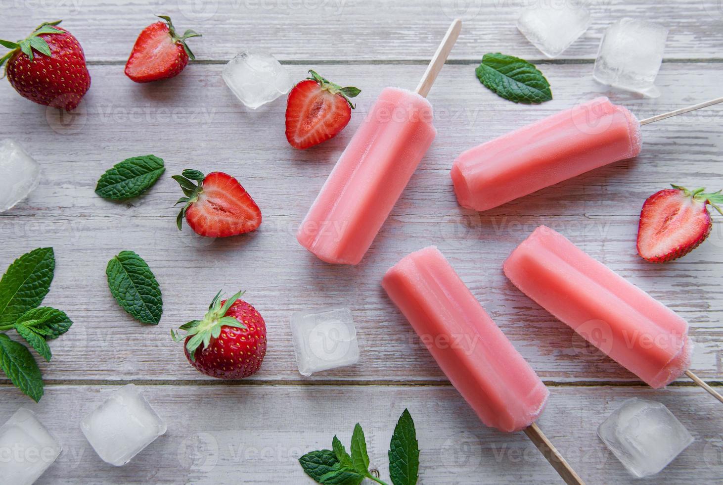 Strawberry ice cream popsicles photo