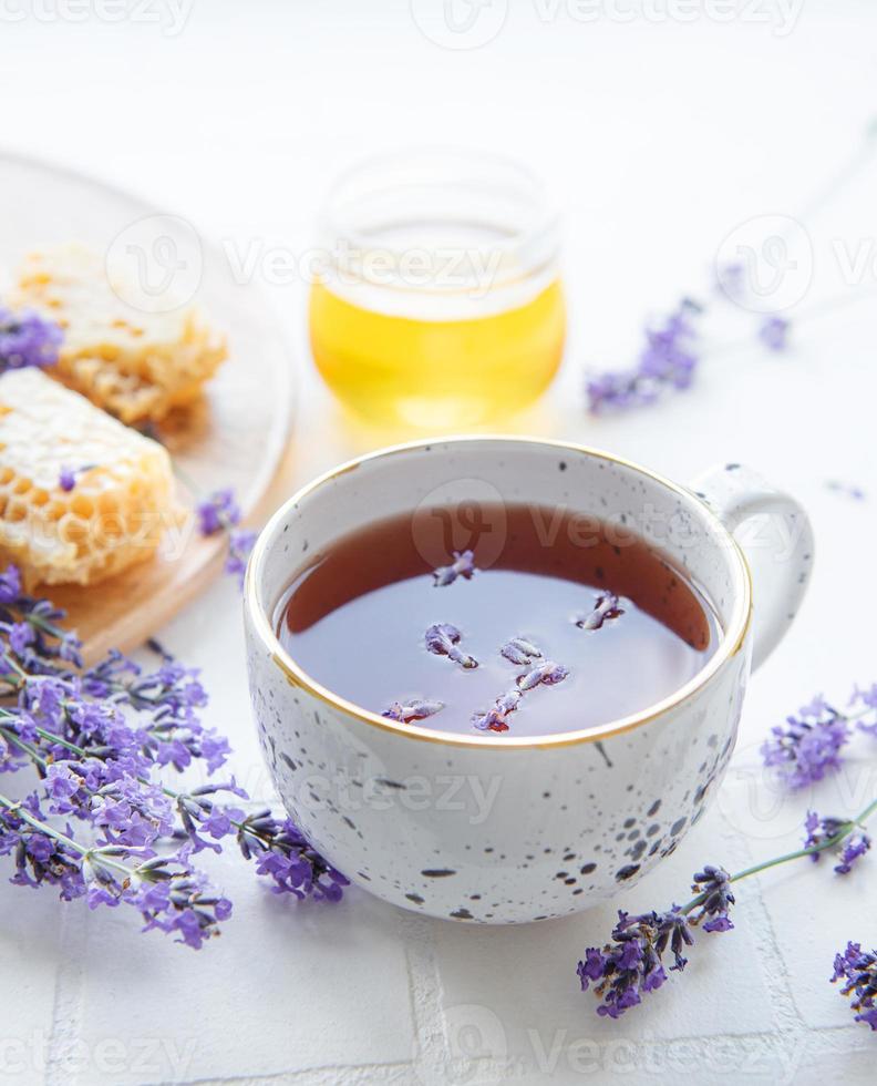 Lavender tea cup, jar of honey photo