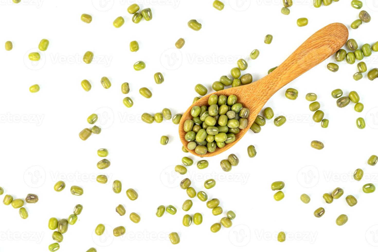 green mung beans with wooden spoon isolated on white background photo
