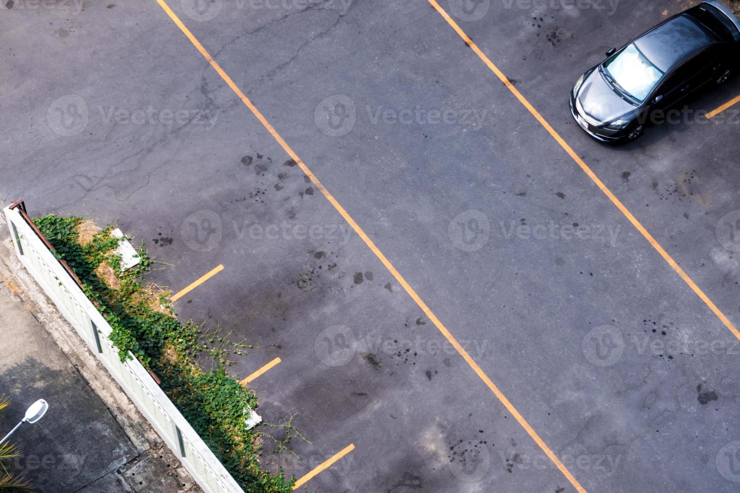 High angle view of a weed-covered parking lot photo