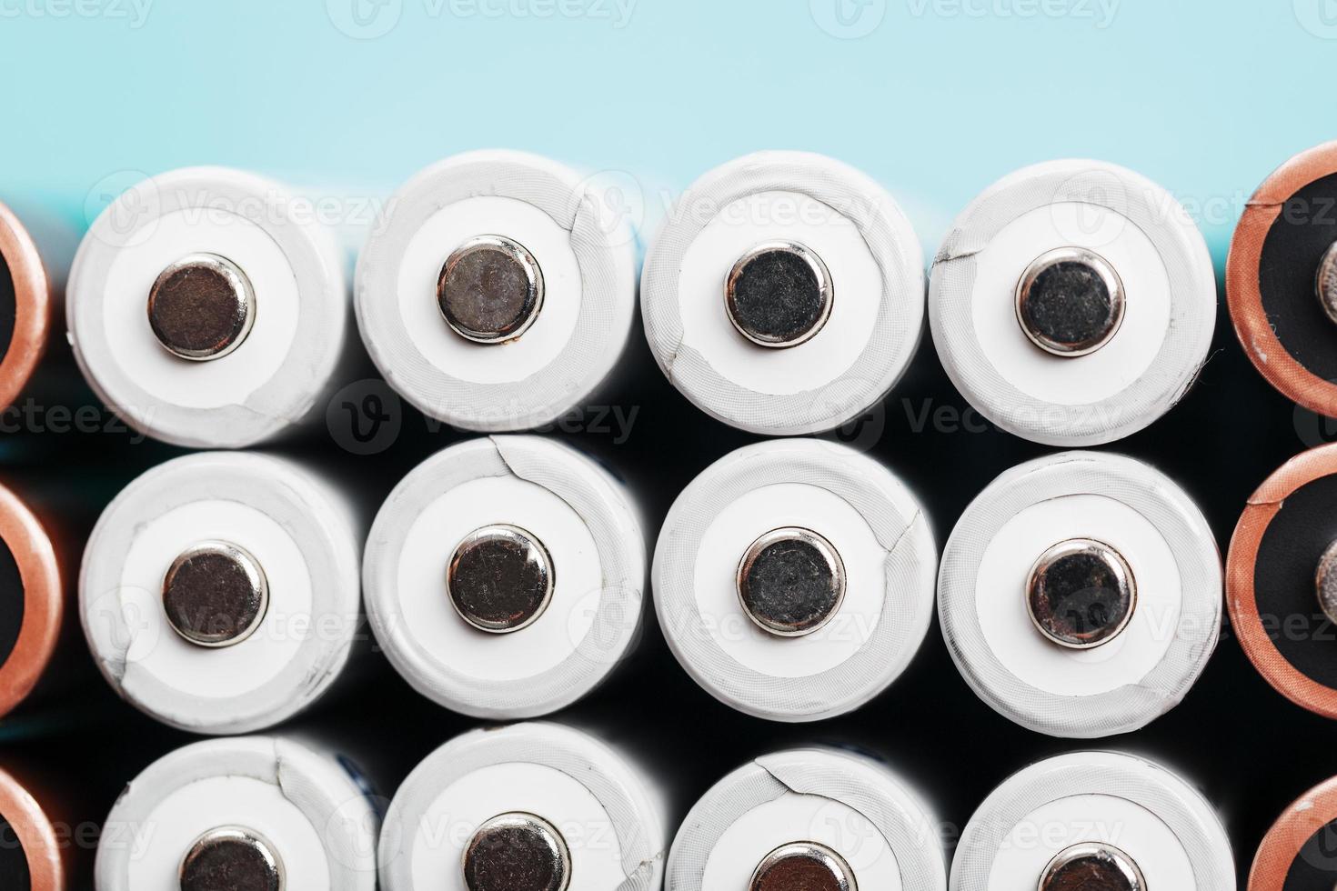 AA batteries as a texture background in full screen. photo