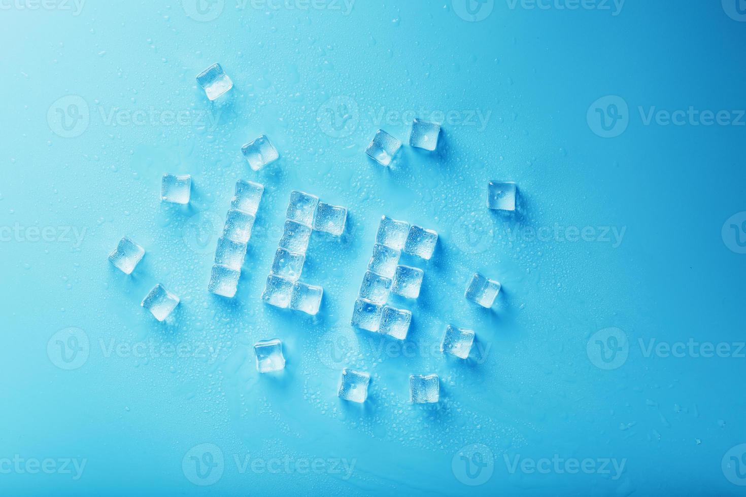 The word ICE is a pattern of ice cubes on a blue background. photo
