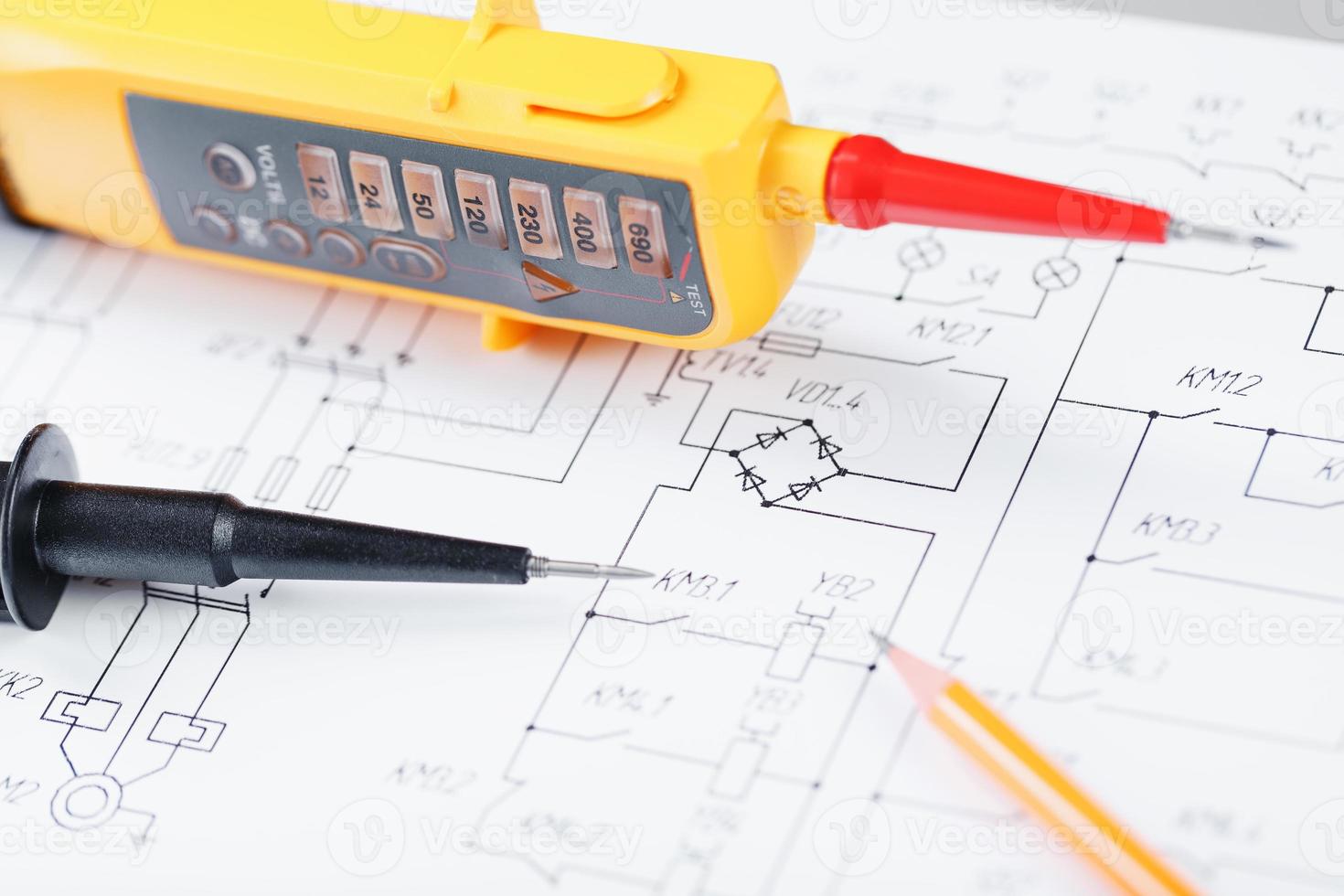 Yellow tester for step-by-step voltage indication on the electrical circuit. photo