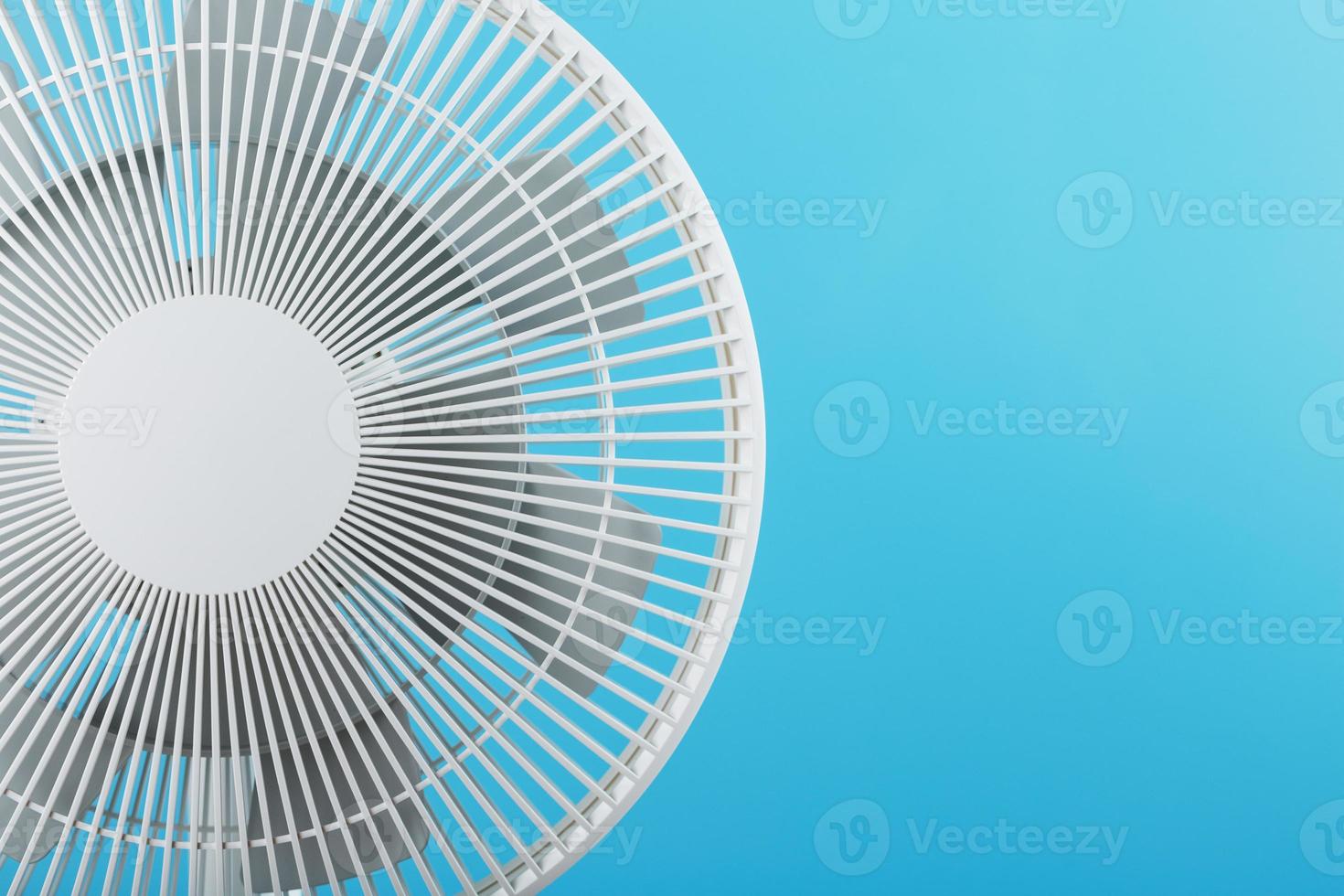 Electric fan in white with a modern design for cooling the room on a blue background photo