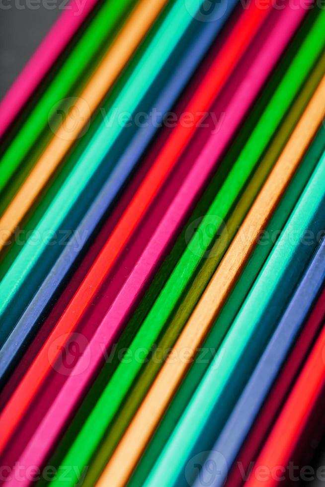 The texture of multi-colored pencils is close-up in full screen. photo