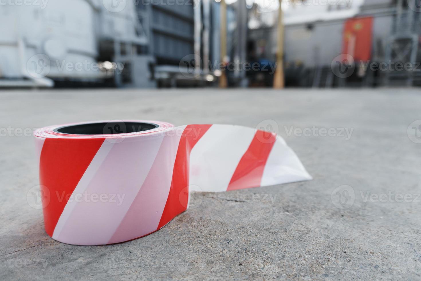 A roll of red and white Signal tape for the safe fencing of the zeil area. photo