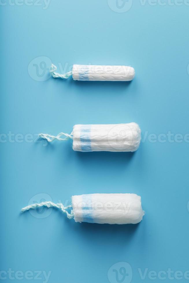 Gynecological tampons on a blue background free space photo