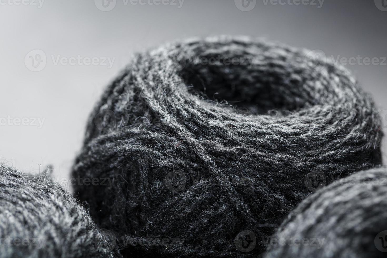 Tangles of gray yarn made of natural wool close-up photo