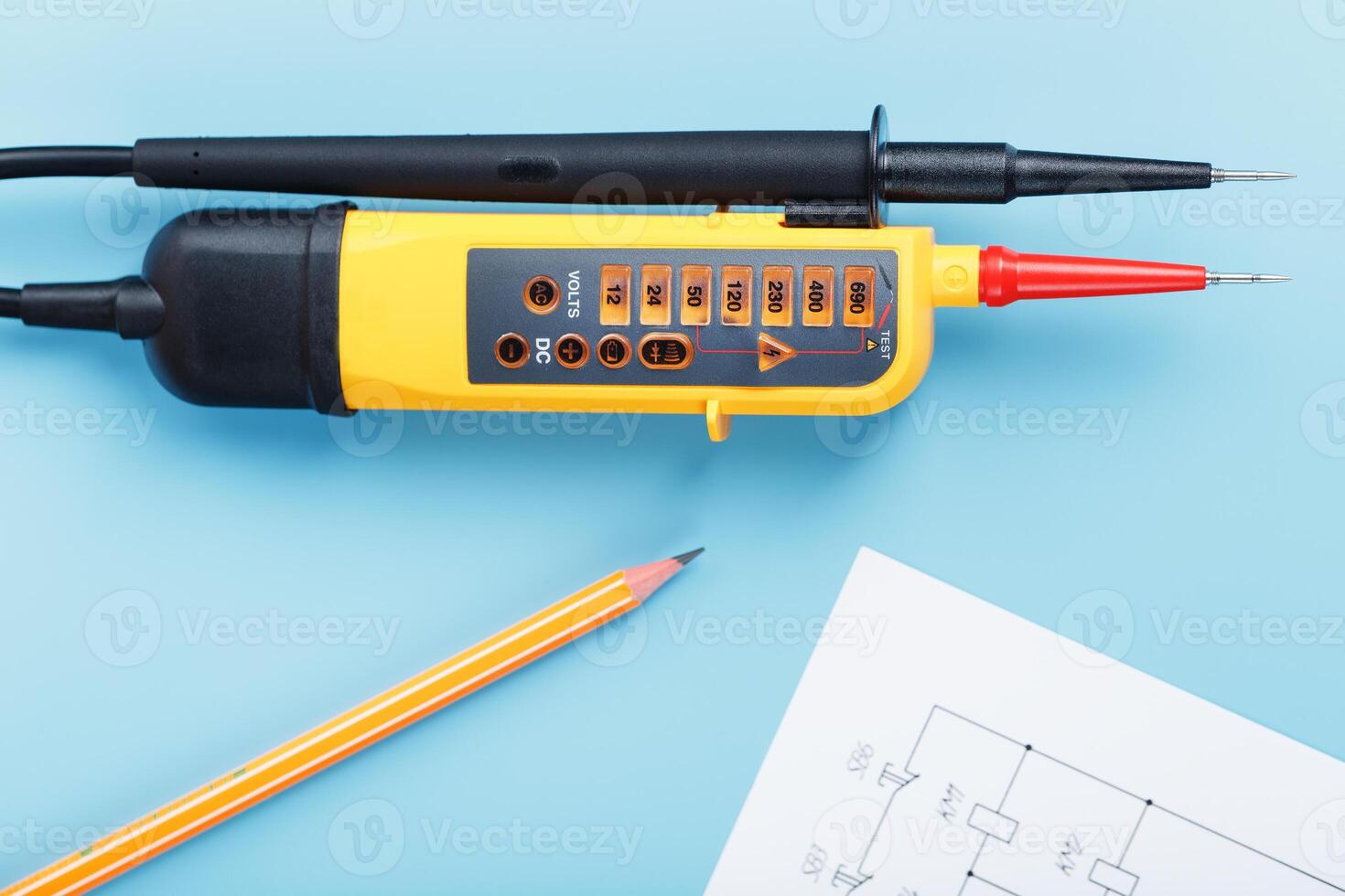 Yellow voltage indicator with an electrical diagram on a blue