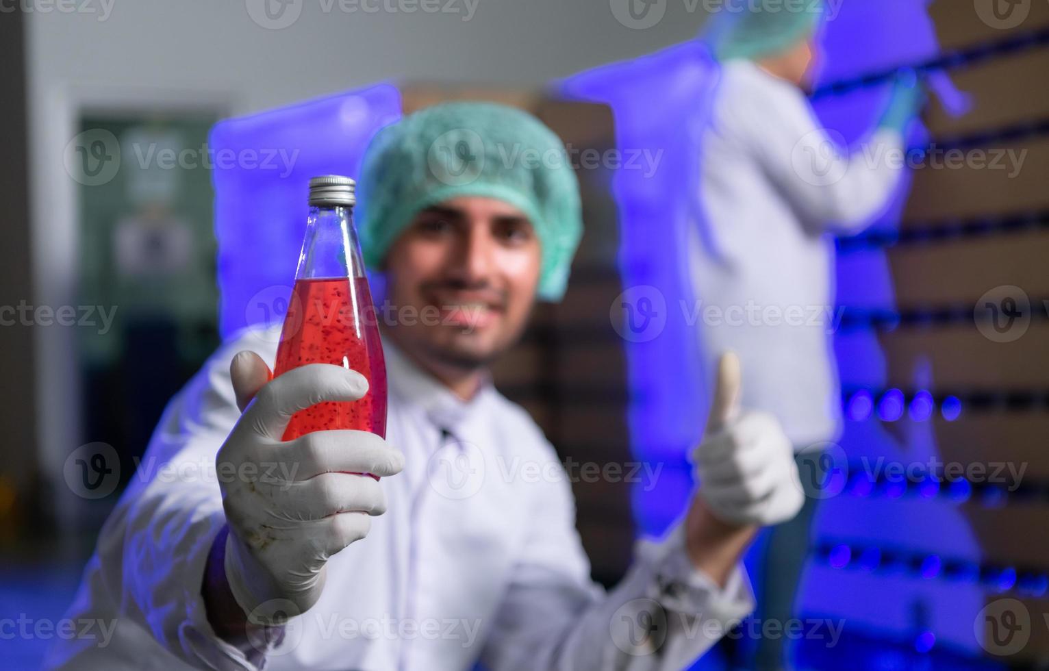 Scientists and their interactions with ready-to-drink bottled juice products that come into the factory to check the quality photo