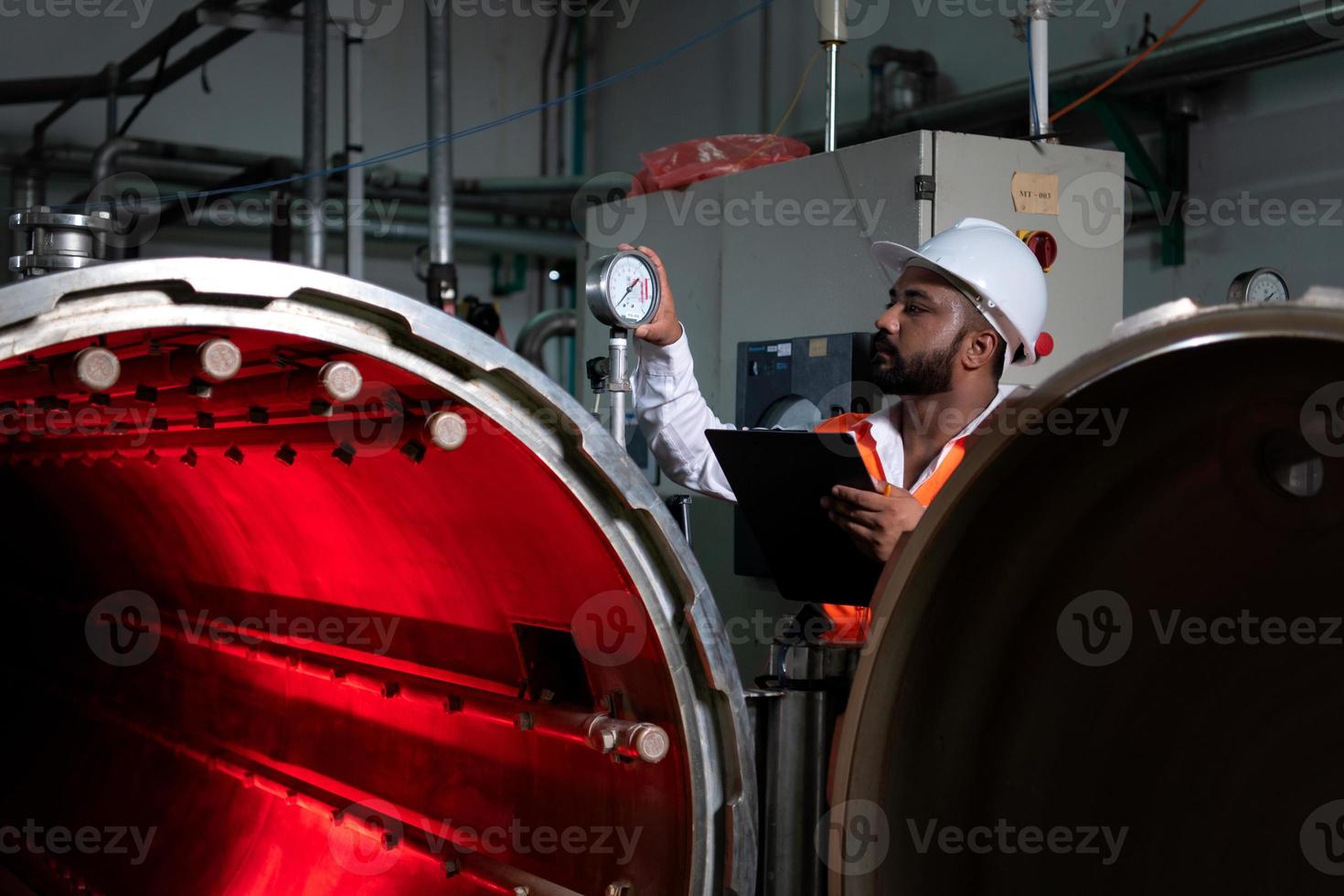 Chief Engineer of the Mechanical Plant Conduct inspection of the sterilization machine tunnel. To check the working condition of the machine to be ready photo