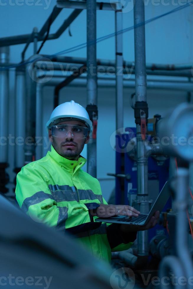 Engineer of the Mechanical Plant Conduct inspection of the sterilization machine tunnel. To check the working condition of the machine to be ready photo