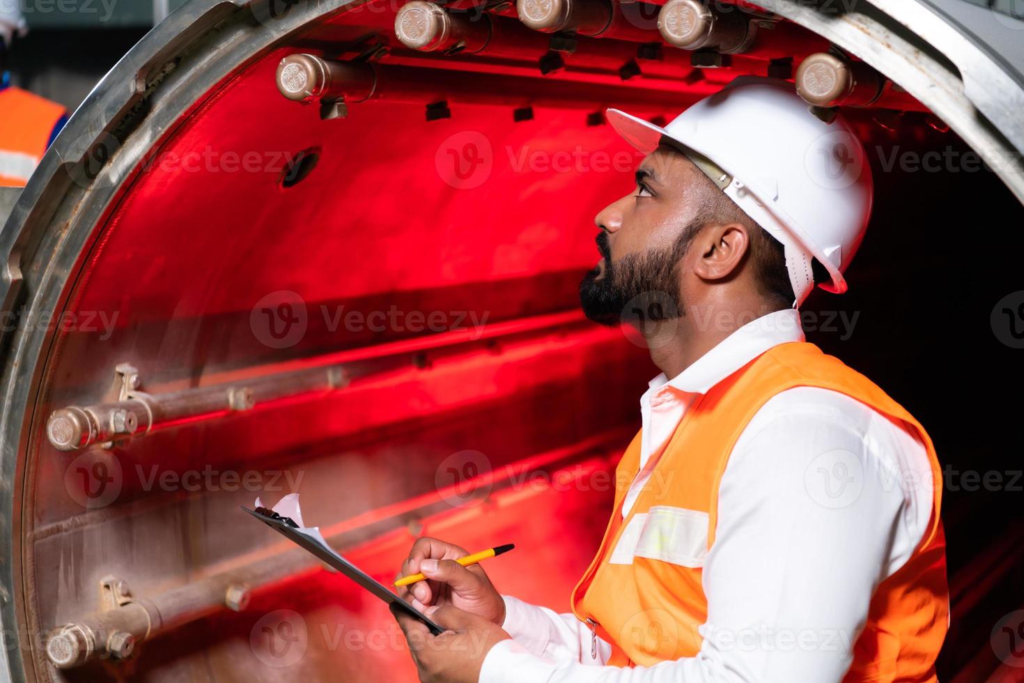 Chief Engineer of the Mechanical Plant Conduct inspection of the sterilization machine tunnel. To check the working condition of the machine to be ready photo