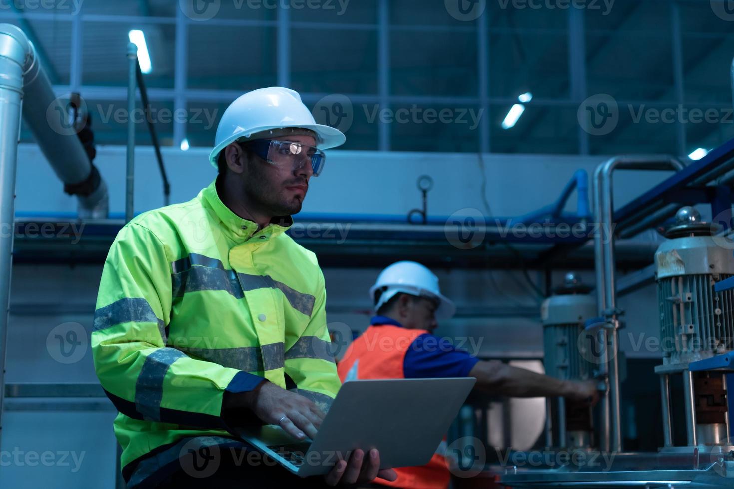 Chief Engineer of the Mechanical Plant Inspecting machine maintenance with factory technicians photo