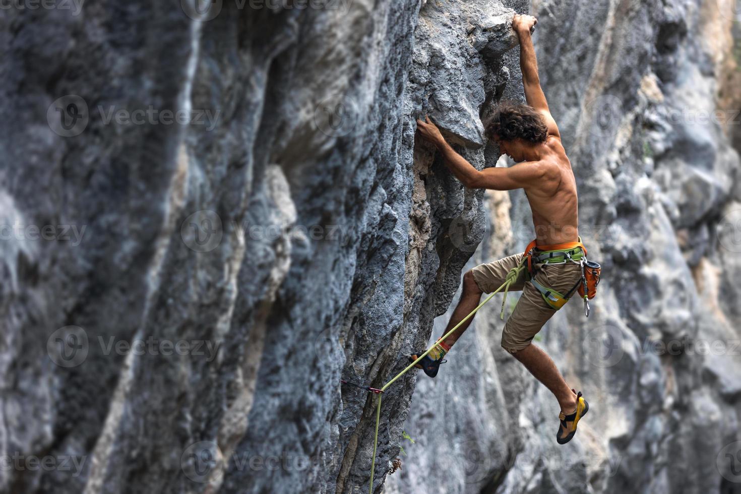 rock climber climbs the rock. photo