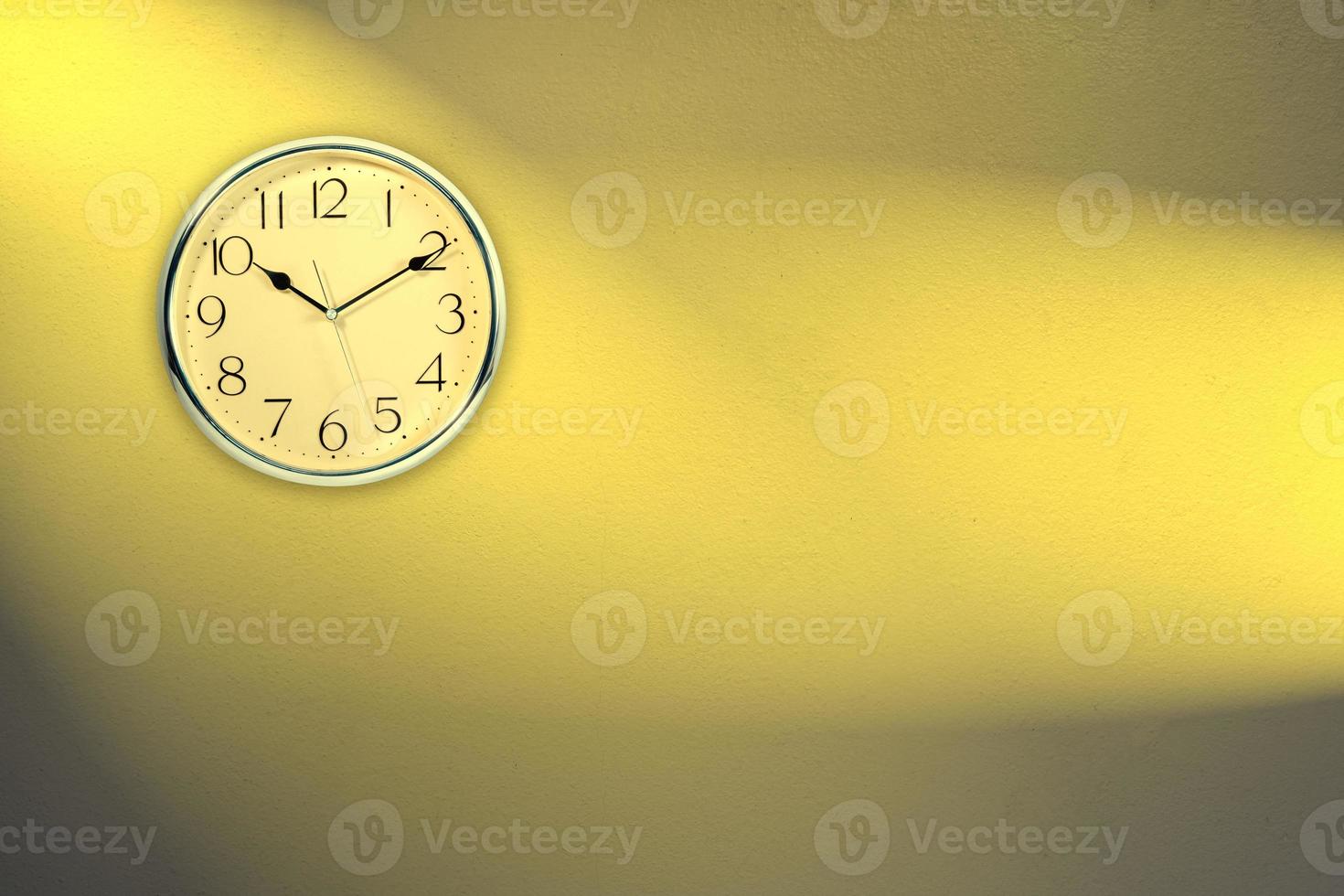 Clock with golden wall backgrounds photo