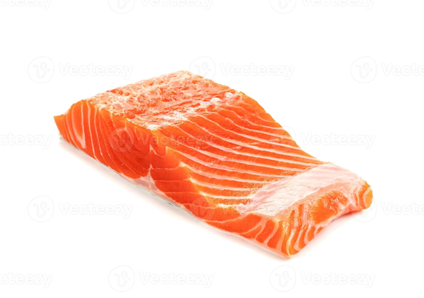 Piece of fresh salmon fillet sliced isolated on white background photo