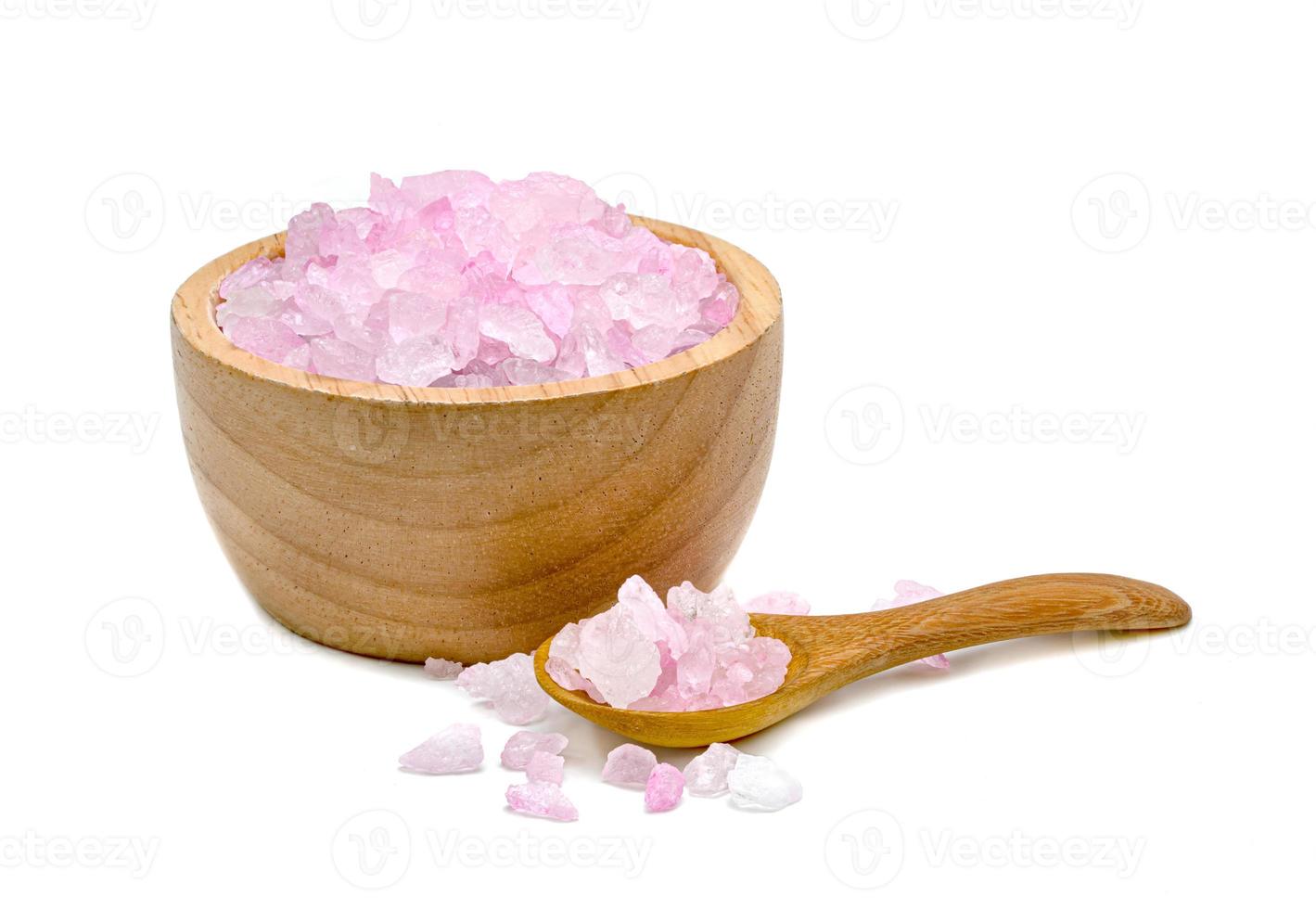 Rock Sugar or crystalline sugar with wooden bowl and spoon isolated on white background photo