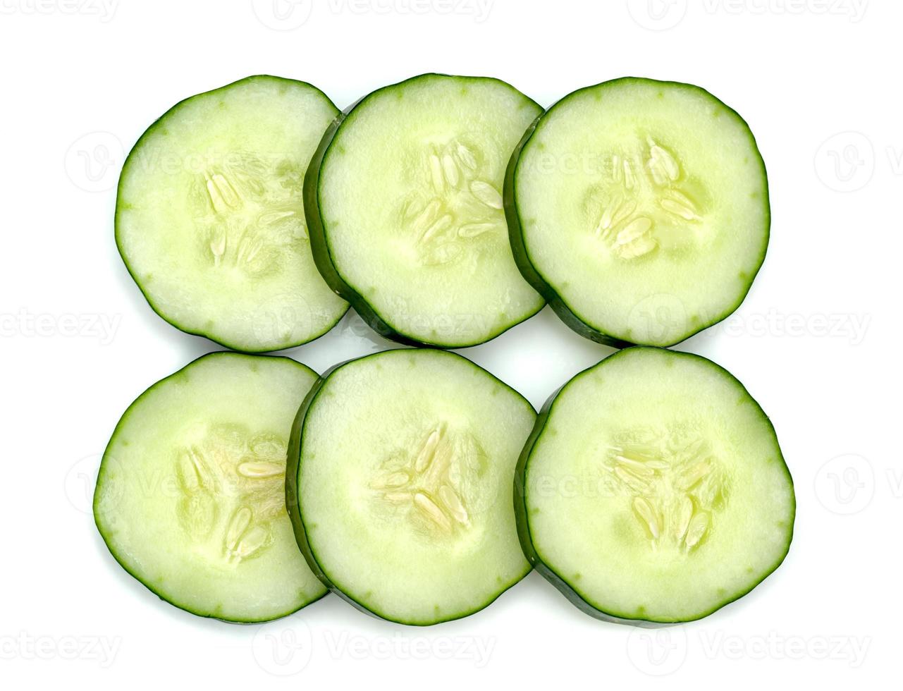 Fresh japanese cucumber sliced isolated on white background photo