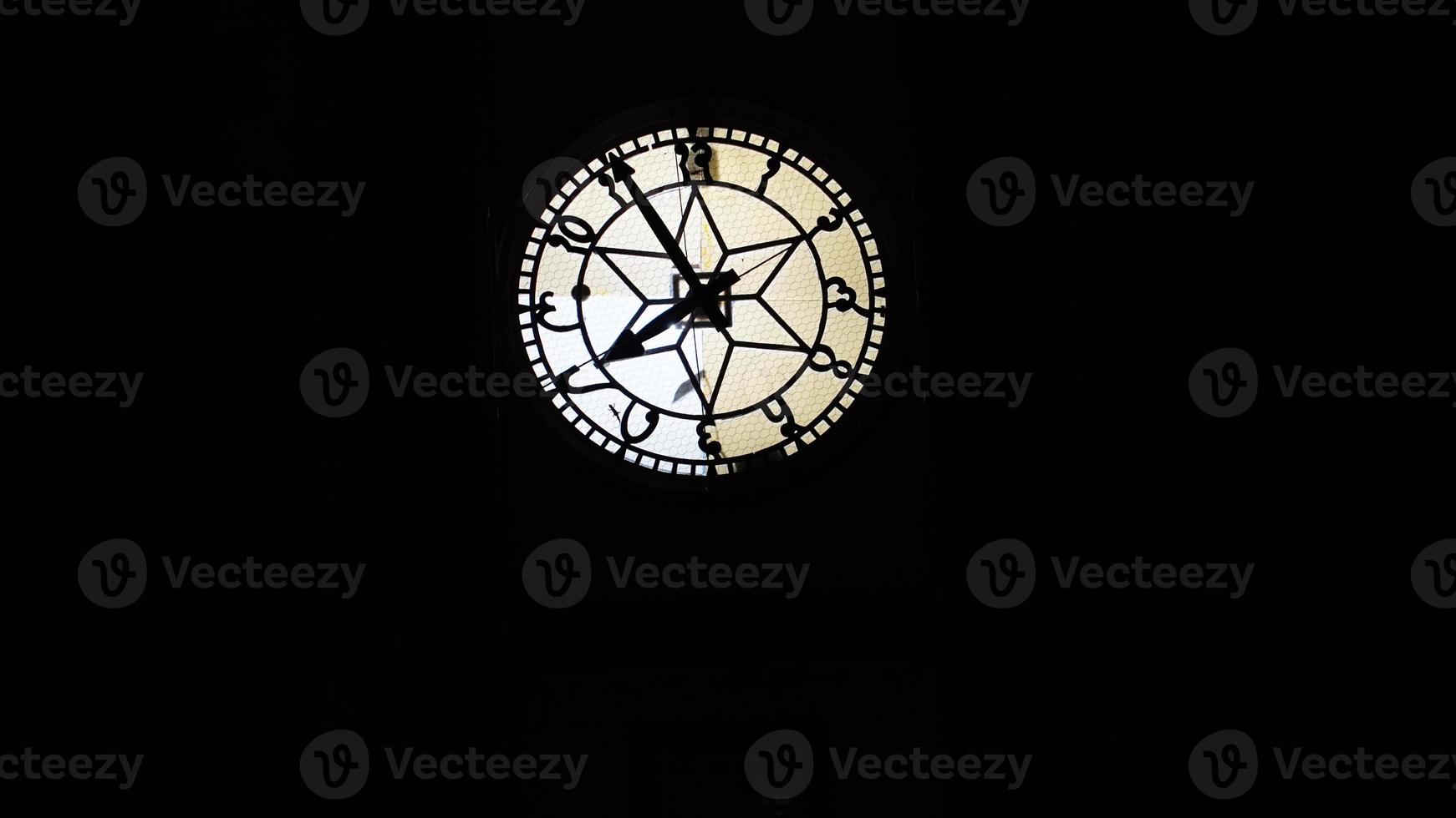 clock tower image in dark background. photo